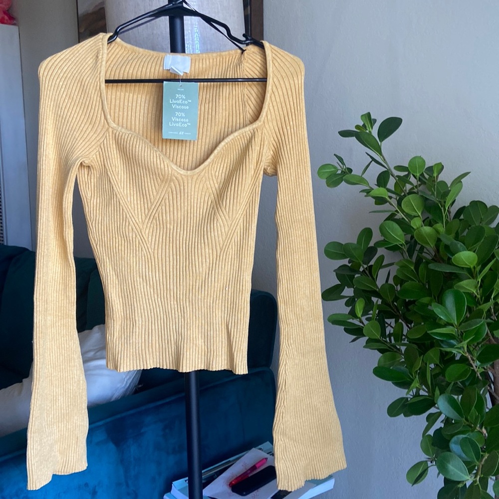 Yellow, sweetheart neck, long sleeve shirt.